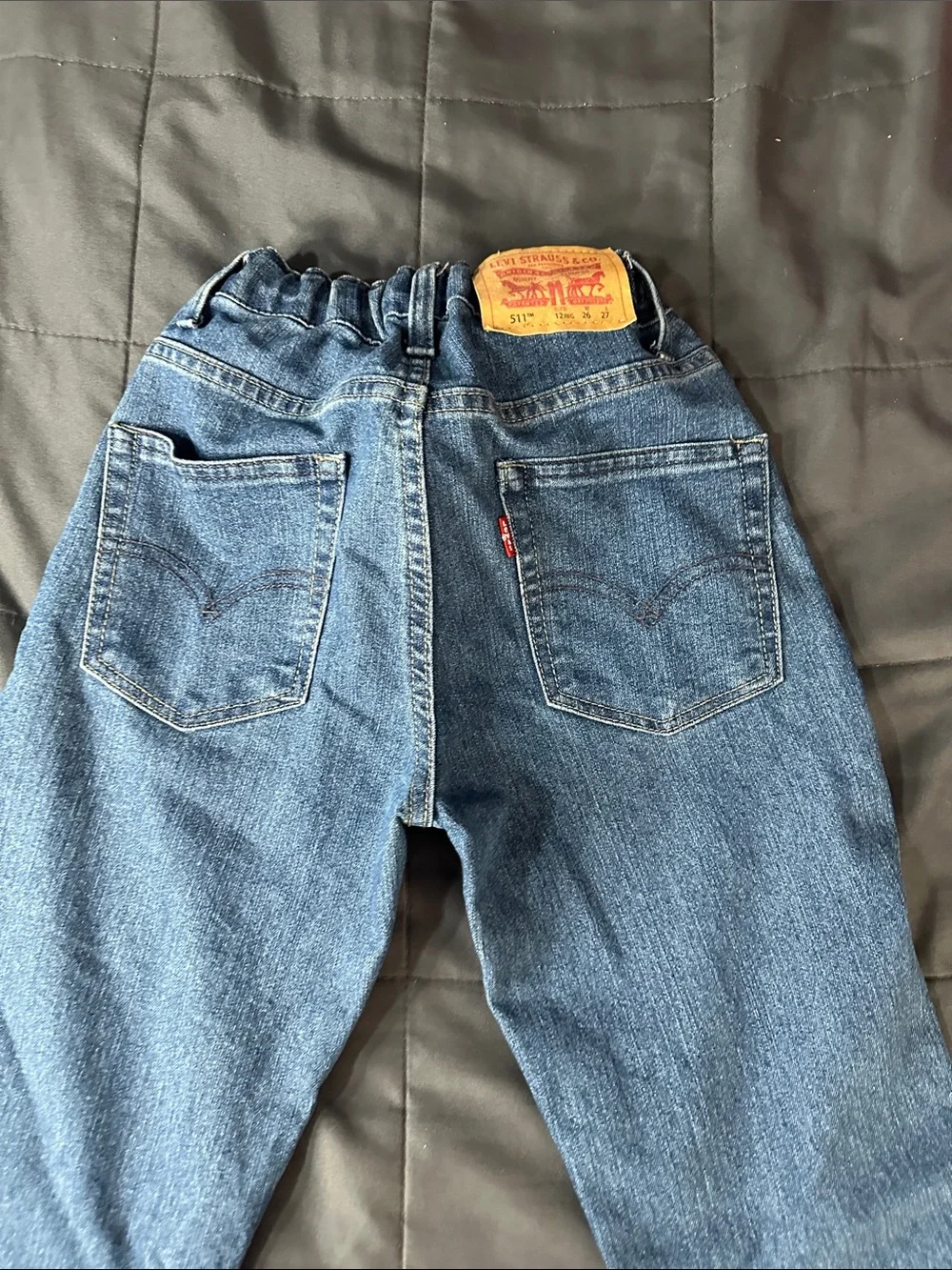 Levi's Straight Men’s Jeans in Medium Blue with Red Waistband Accent